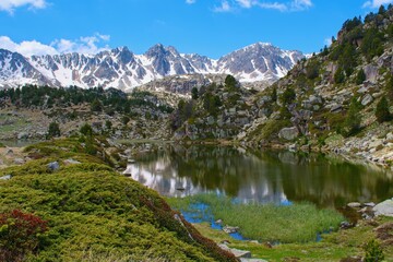 Pyrenees mountain scenery in Andorra country with  mountain lake Estany Primer de Pessons.