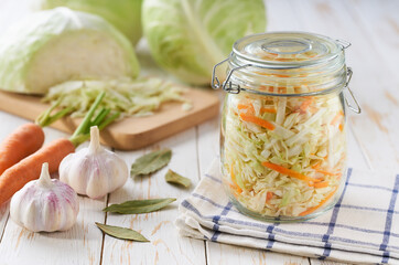 preparation for making sauerkraut or fermented white cabbage with carrot. Food fermentation. Fermented preserved vegetarian food.