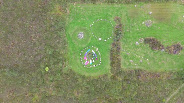 Aerial view of a group of women worshipping at the Beaghmore Stone circles at Blackrock Road by Cookstown in County Tyrone, Northern Ireland