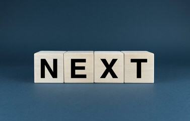 Wooden blocks spelling out the word next