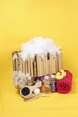 beauty item shampoo mirror bath on yellow background 