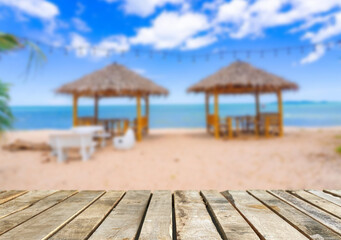 Wooden table top on the beach or sea.Party on the beach  sunset time concept.For montage product display or design key visual layout.View of copy space.
