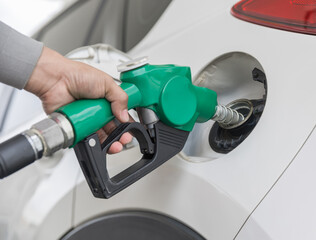 Man Refill and filling Oil Gas Fuel at station. Gas station - refueling.