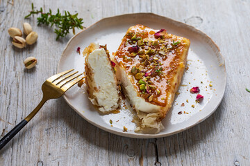 Filo pastry wrapped feta cheese with honey and pistachios