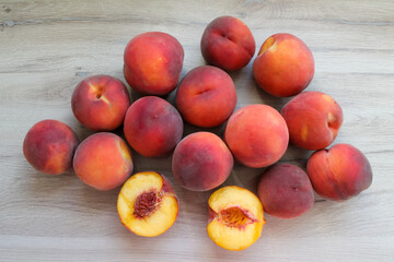 Ripe peaches on a wooden background in the center view from above. High quality photo