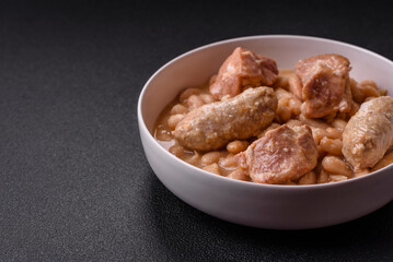 Cassoulet with white beans, meat and sausages, vegetables, salt and spices