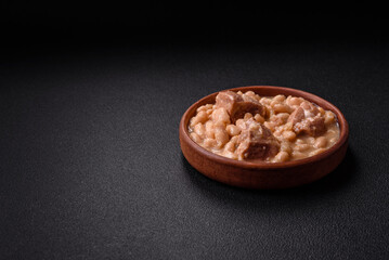 Cassoulet with white beans, meat and sausages, vegetables, salt and spices