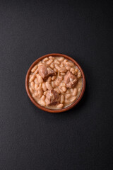 Cassoulet with white beans, meat and sausages, vegetables, salt and spices