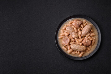Cassoulet with white beans, meat and sausages, vegetables, salt and spices