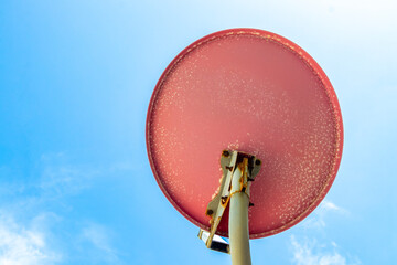 Satellite dish antenna and blue sky in Mexico.