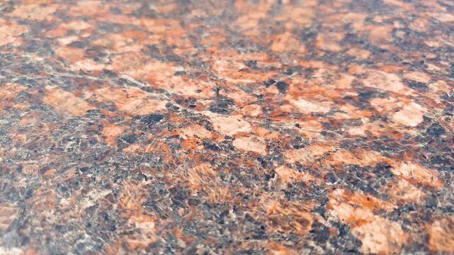 Granite slab. Natural granite stone of red color, granite polished surface,facade.