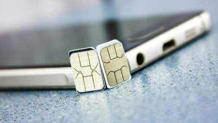 Sim card and smartphone. 2 sim cards near the smartphone, calls, connection, cellular operator subscriber,animation.