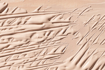 Abstract delicate minimalist beige background, cosmetic cream stroke.