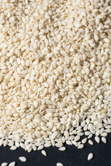 Macro kernels of white roasted sesame seeds.