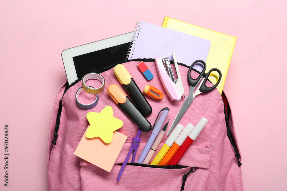 Poster backpack and different school stationery on pink background, top view