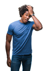 Afro american man over isolated background surprised with hand on head for mistake, remember error....