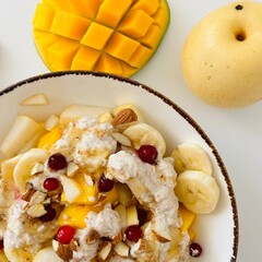 Fresh Fruit Salad in Bowl with Banana and Mango