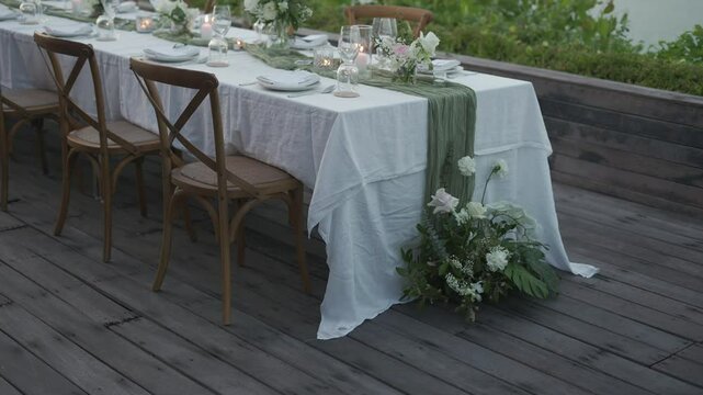 Wedding reception dinner decorations Dinner table setup . Close up decoration flowers candles Boho style. Romantic wedding reception party
