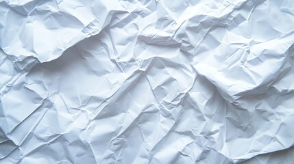Fototapeta premium White crumpled paper background. Perfect for adding a textured look to your designs.
