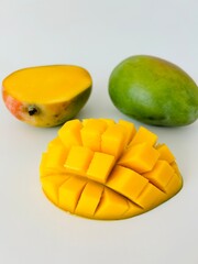 Ripe Mango Fruit Cut into Cubes Isolated on White Background