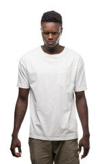 Fototapeta premium Young african american man wearing white t-shirt skeptic and nervous, frowning upset because of problem. Negative person.