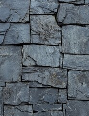 Textured Slate Stone Wall with Intricate Patterns and Geometric Formations