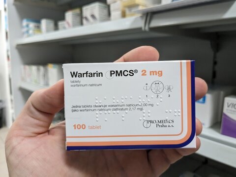Prague, Czech Republic - SEPTEMBER 13 2024: WARFARIN PMCS 2mg box of medication with WARFARIN active substance by PMCS, used for treatment of blood clot prevention and stroke risk reduction.

