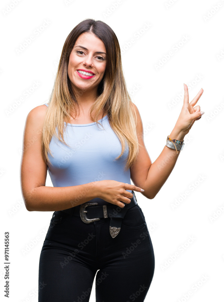 Wall mural young beautiful elegant business woman over isolated background smiling with happy face winking at t