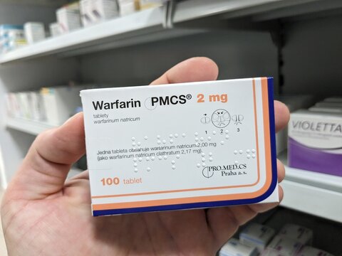 Prague, Czech Republic - SEPTEMBER 13 2024: WARFARIN PMCS 2mg box of medication with WARFARIN active substance by PMCS, used for treatment of blood clot prevention and stroke risk reduction.

