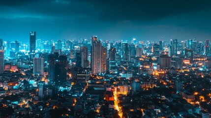 Night cityscape with illuminated buildings and street lights.