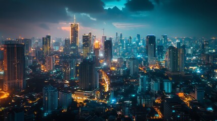 Fototapeta premium Nighttime city skyline with buildings illuminated by lights.