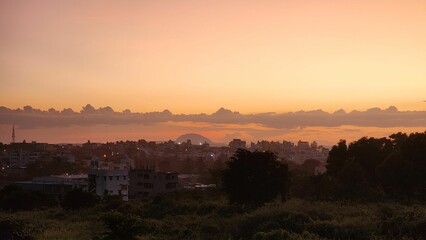 Cityscape at sunset with orange sky