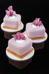 Ready to eat. Delicious cake against black background