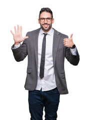 Young handsome business man over isolated background showing and pointing up with fingers number six while smiling confident and happy.