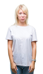 Young beautiful blonde woman wearing white t-shirt over isolated background depressed and worry for distress, crying angry and afraid. Sad expression.