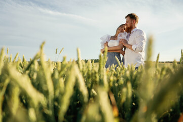 Non urban view, leisure. Lovely couple are on the green agricultural field together