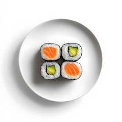 Minimalist sushi arrangement on white plate - fresh salmon and avocado rolls