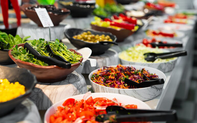 Chopped vegetables and vegetable salads. All-inclusive concept.