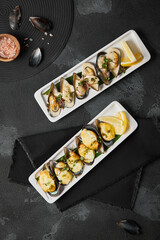 Gourmet Baked Mussels Cheesy Delight and Savory Sauce - Culinary Art on Black Slate