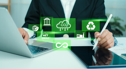 Business woman analyze investment sustainability ESG icons. ESG environmental protection concept, Sustainable development, Climate change, Green energy recycle, Net zero and carbon neutral.