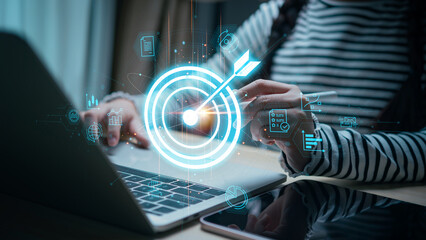 Businesswomen with target arrow virtual digital technology icon, business investment objectives and...