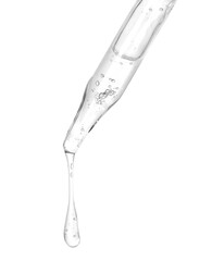 Dripping cosmetic serum from pipette on white background