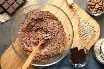 Ingredients for chocolate dough on grey table, flat lay