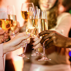 Cheers. Unrecognizable Young People Clinking Champagne Glasses Celebrating New Year Indoor. Closeup, Selective Focus