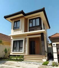 Obraz premium Modern Two Story House with Brown Facade and Black Windows