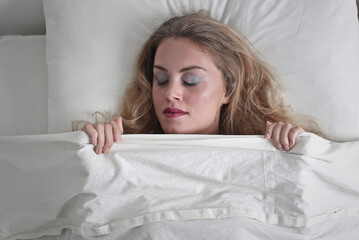 woman sleeps in the bed