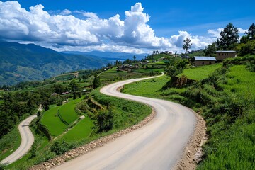 A rural road winding up a mountain, offering breathtaking views of the valleys and farms below