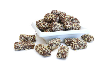 Almond butter chocolate bar candy isolated in bowl on white