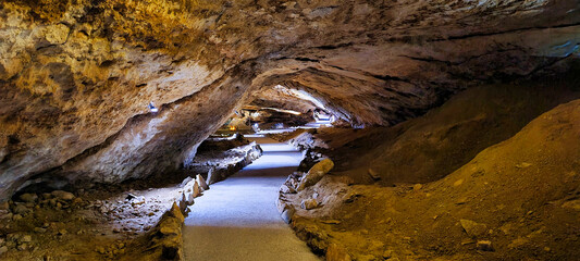 The Dachstein Mammoth Cave in Austria is a breathtaking underground formation with vast chambers and intricate tunnels, showcasing ancient limestone structures. This natural wonder invites exploration