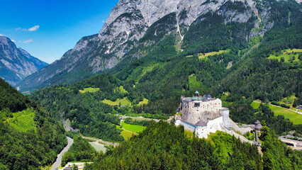 Hohenwerfen Castle in Austria stands proudly amidst lush green forests and mountainous terrain. This medieval fortress offers stunning panoramic views and rich historical significance, making it a pop